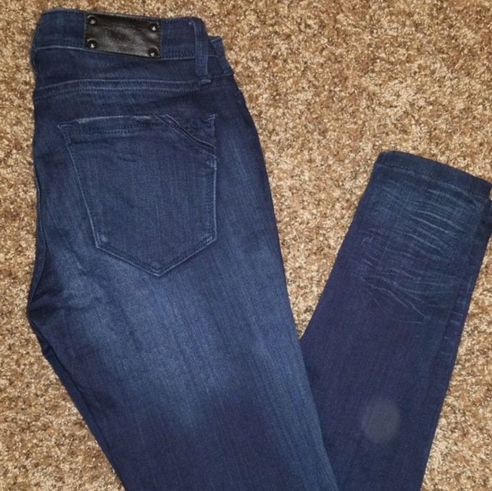 Buckle black skinny jeans